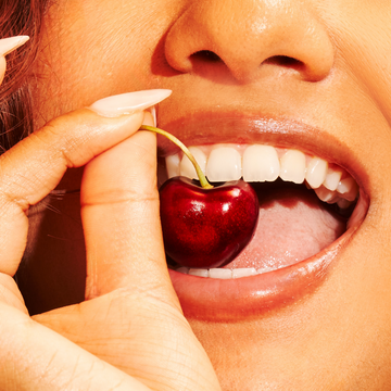 IMAGE 3: MODEL BITING CHERRY